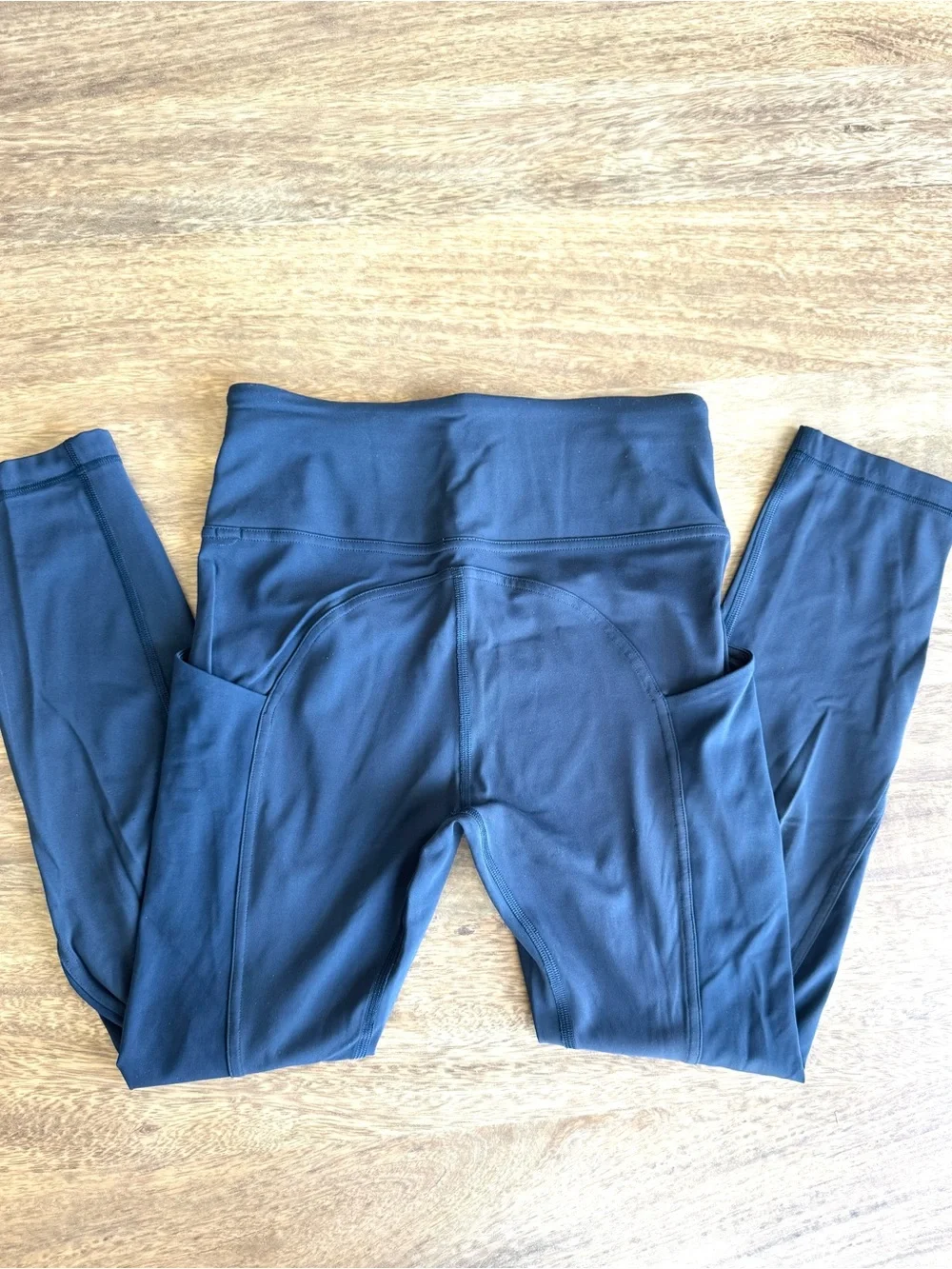 Lululemon performance leggings in a dark navy blue with Side Pockets